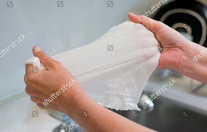 Paper sheet held over a sink